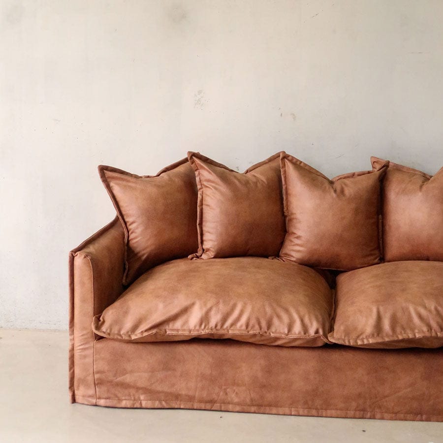 The Cloud 2 Seater Sofa with Tan Leatherette Slipcover By Black Mango Interiors