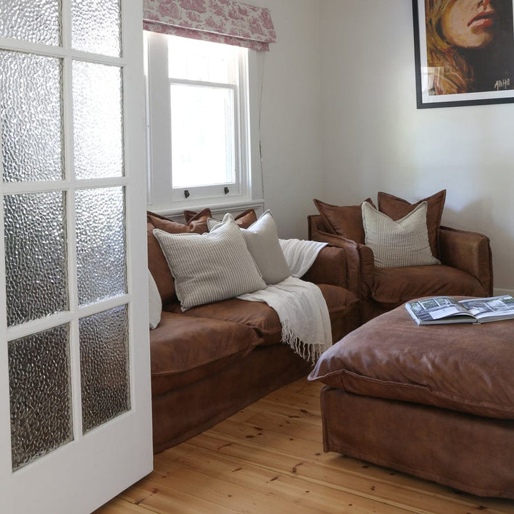 The Cloud 3 Seater Sofa with Tan Leatherette Slipcover By Black Mango Interiors