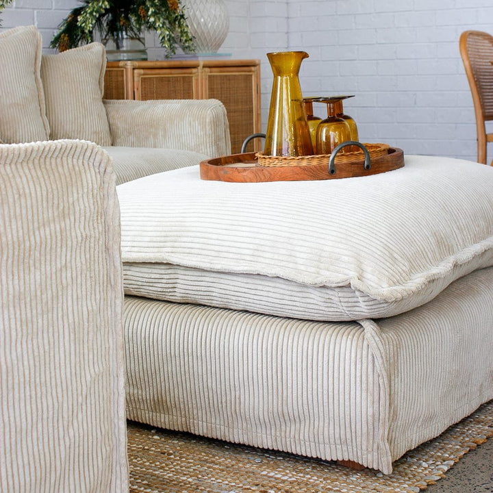 The Cloud Ottoman with Almond Corduroy Slipcover By Black Mango