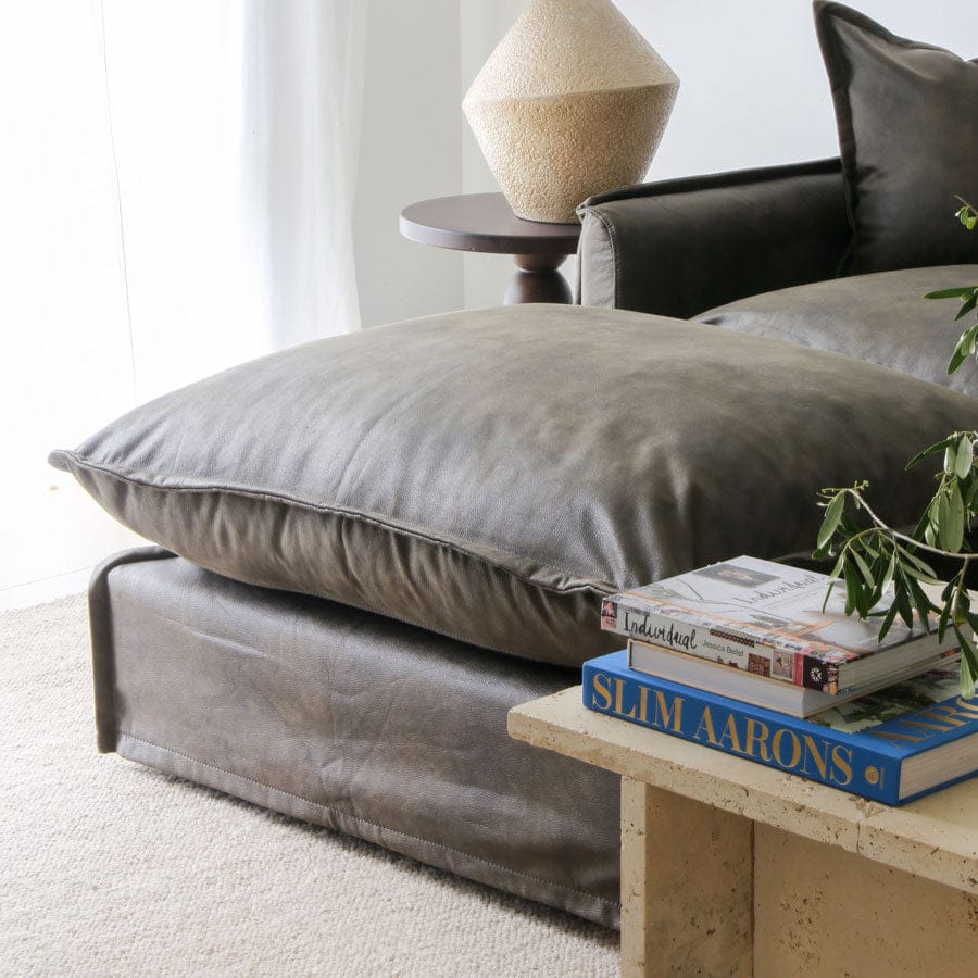 The Cloud Ottoman with Brunswick Leatherette Slipcover By Black Mango Interiors