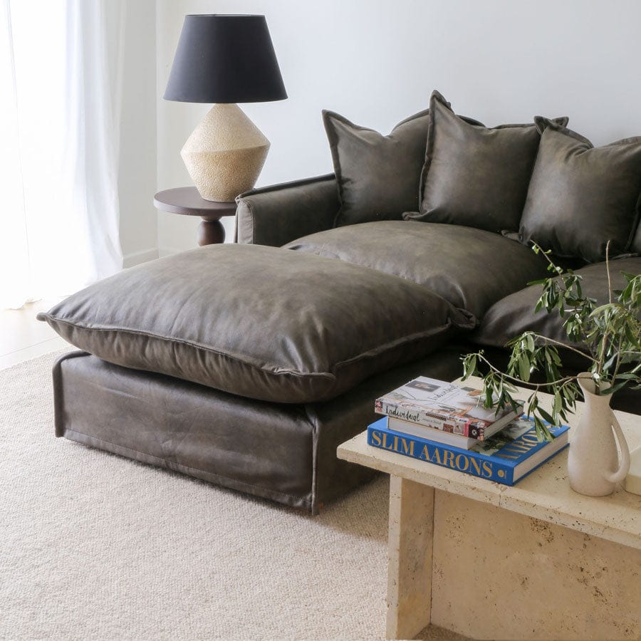 The Cloud Ottoman with Brunswick Leatherette Slipcover By Black Mango Interiors