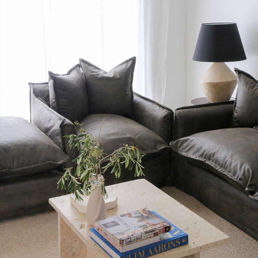 The Cloud Ottoman with Brunswick Leatherette Slipcover By Black Mango Interiors