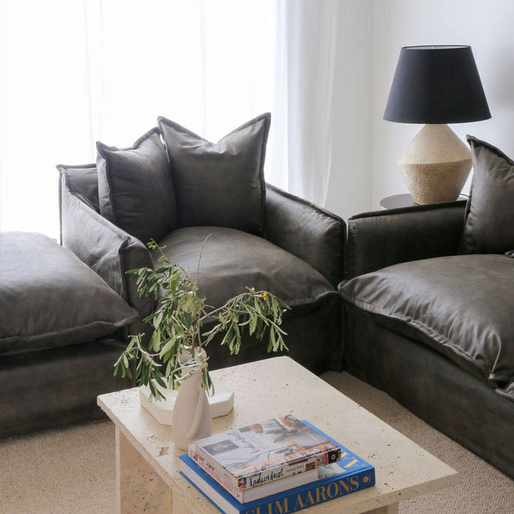 The Cloud Ottoman with Brunswick Leatherette Slipcover By Black Mango Interiors