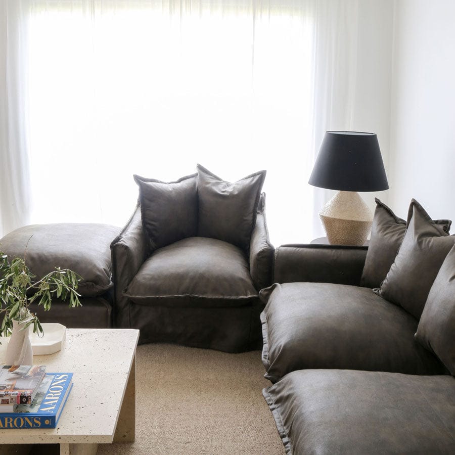 The Cloud Ottoman with Brunswick Leatherette Slipcover By Black Mango Interiors