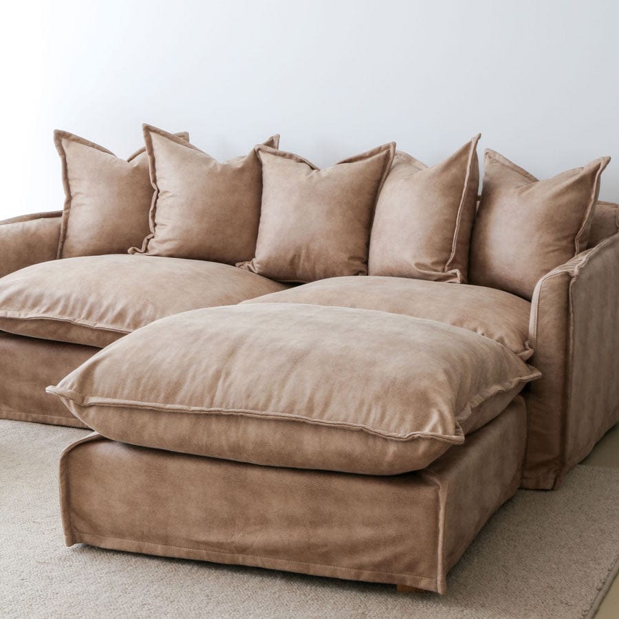 The Cloud Ottoman with Fawn Leatherette Slipcover By Black Mango Interiors