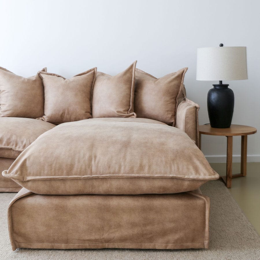 The Cloud Ottoman with Fawn Leatherette Slipcover By Black Mango Interiors