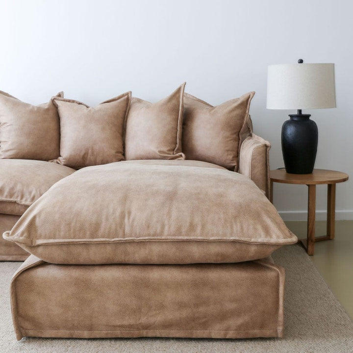 The Cloud Ottoman with Fawn Leatherette Slipcover By Black Mango Interiors