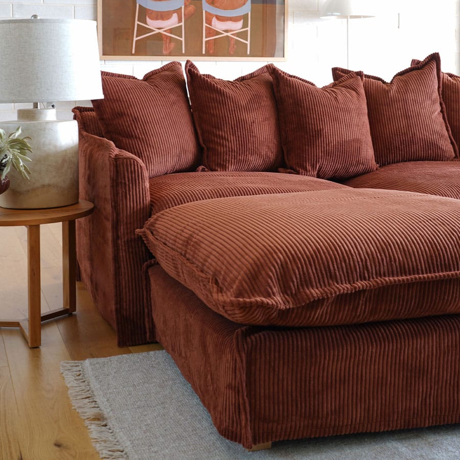 The Cloud Ottoman with Rust Corduroy Slipcover By Black Mango Interiors