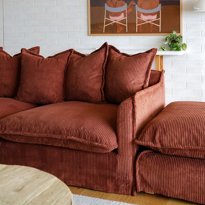 The Cloud Ottoman with Rust Corduroy Slipcover By Black Mango Interiors