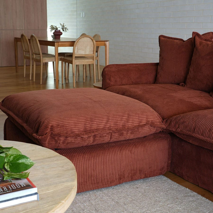 The Cloud Ottoman with Rust Corduroy Slipcover By Black Mango Interiors