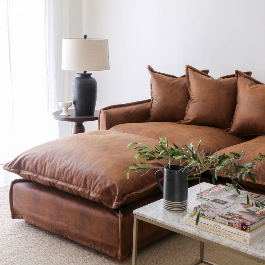 The Cloud Ottoman with Tan Leatherette Slipcover By Black Mango Interiors