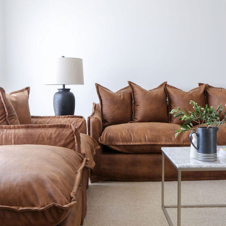 The Cloud Ottoman with Tan Leatherette Slipcover By Black Mango Interiors