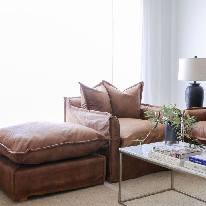The Cloud Ottoman with Tan Leatherette Slipcover By Black Mango Interiors