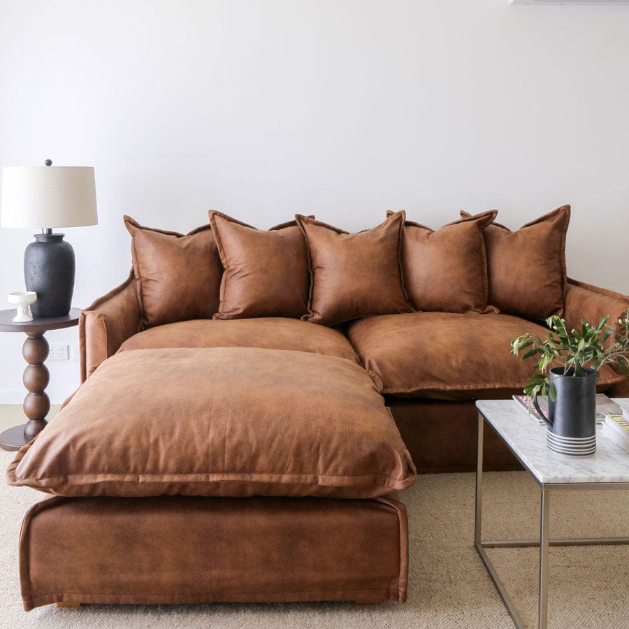 The Cloud Ottoman with Tan Leatherette Slipcover By Black Mango Interiors