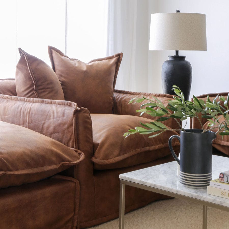 The Cloud Single Seater with Tan Leatherette Slipcover By Black Mango Interiors